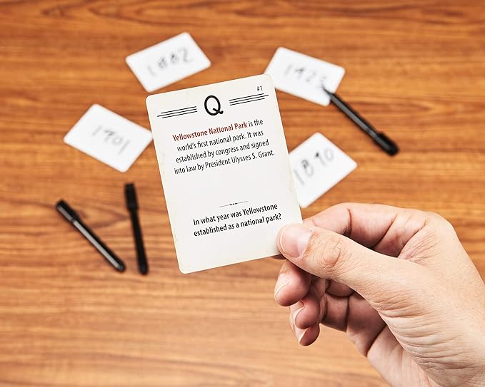 Board game components from 'Trekking the National Parks Trivia' set up for play.